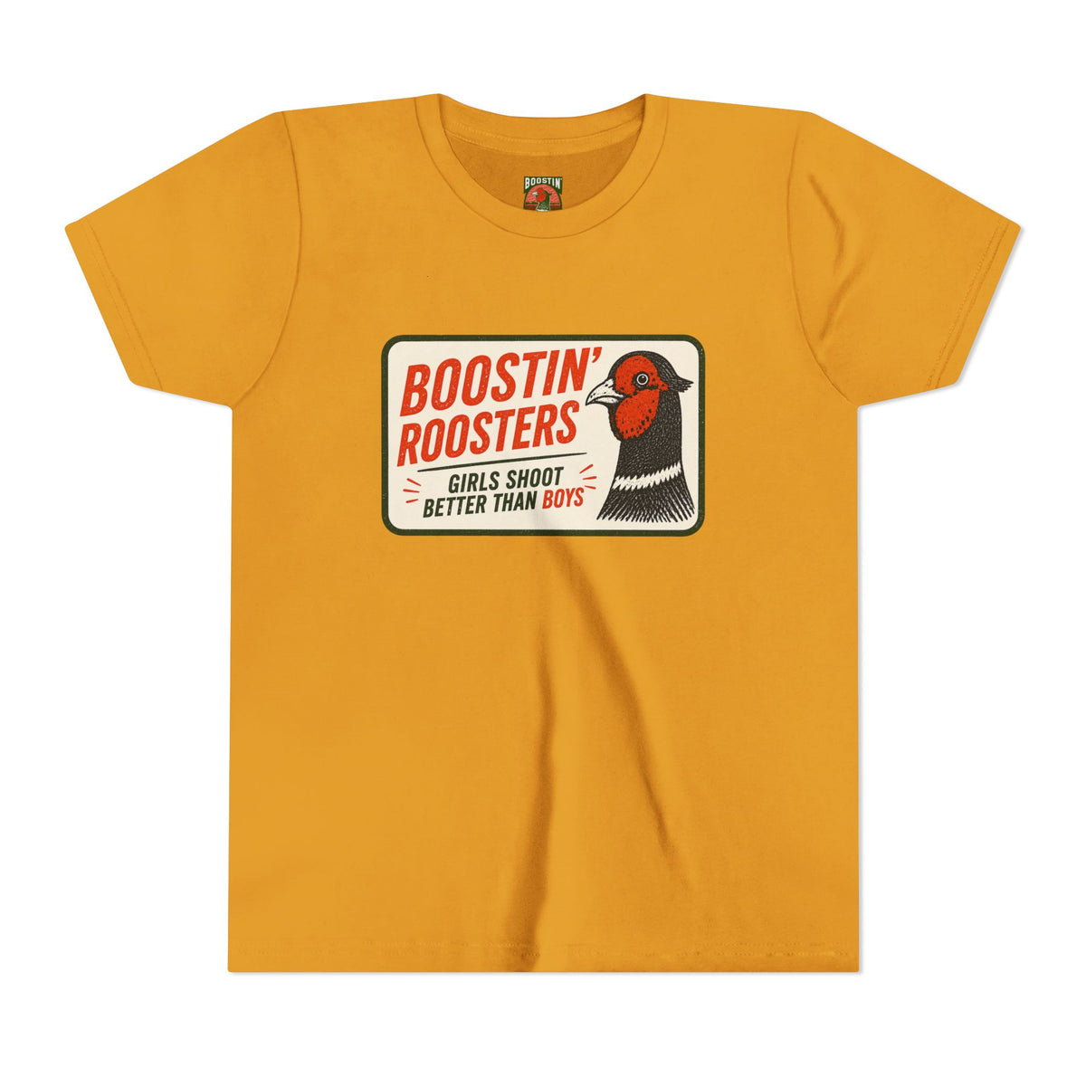 A mustard yellow short-sleeve t-shirt with a vintage-style graphic on the chest. The graphic features a white rounded rectangle with the text 'BOOSTIN' ROOSTERS' in red, 'GIRLS SHOOT BETTER THAN BOYS' in black and red, and an illustration of a pheasant bird.
