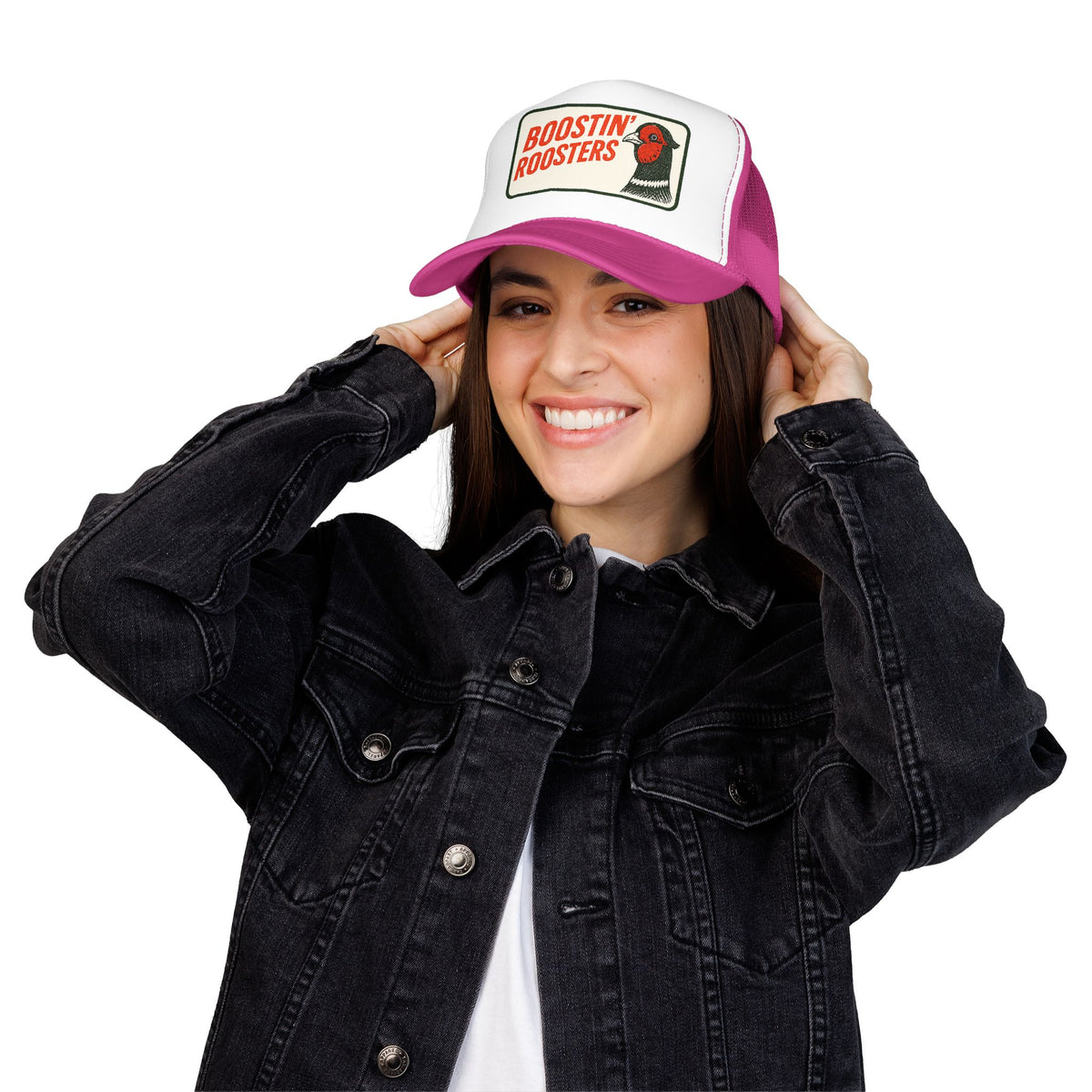 Person wearing a pink and white cap with 'Boostin Roosters' logo, black denim jacket, and white shirt on a white background.