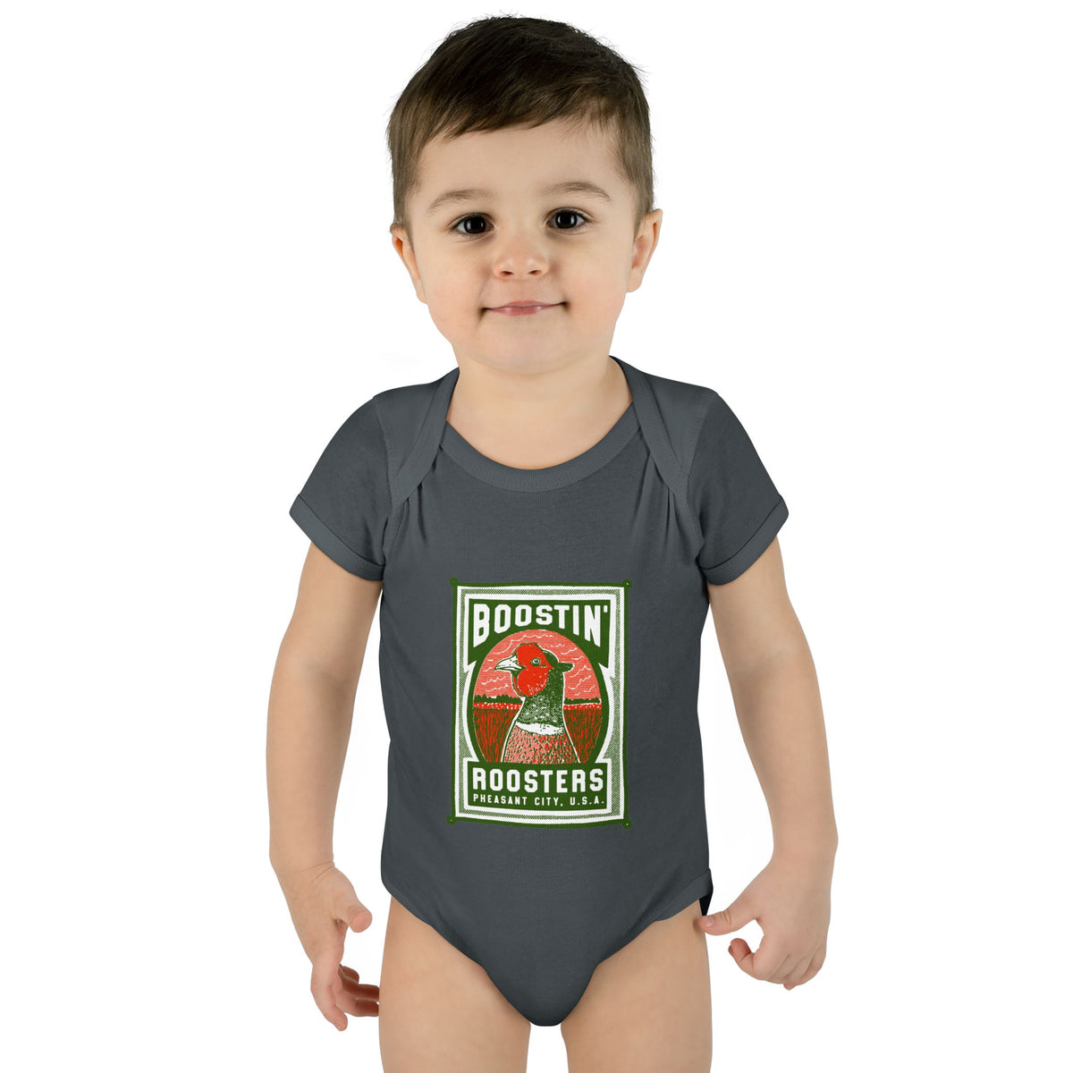 Child wearing a gray onesie with 'Boostin' Roosters'' text.