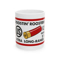 A white ceramic mug featuring a printed design of a red and gold shotgun shell with black text reading 'BOOSTIN' ROOSTERS' and 'XTRA LONG-RANGE', along with '12 GAUGE 5 1/2 IN'.