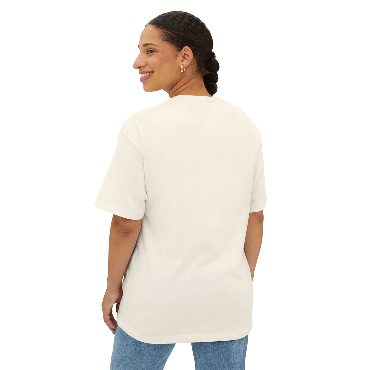 Woman wearing a white t-shirt and blue jeans on a white background
