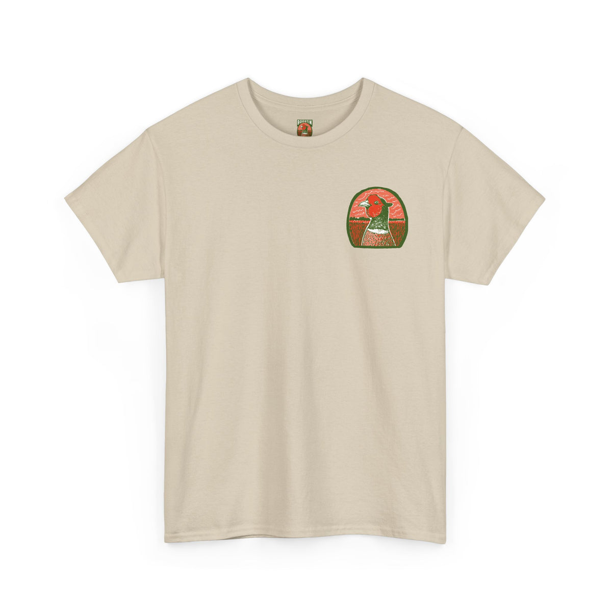 A tan short-sleeve crewneck t-shirt with a small circular graphic printed on the left chest, featuring a pheasant head.
